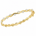RANKE diamantarmbånd i 14 karat gulguld med ca. 2,50 ct. diamanter og et skulpturelt, bølgende design fra Stensgaard.